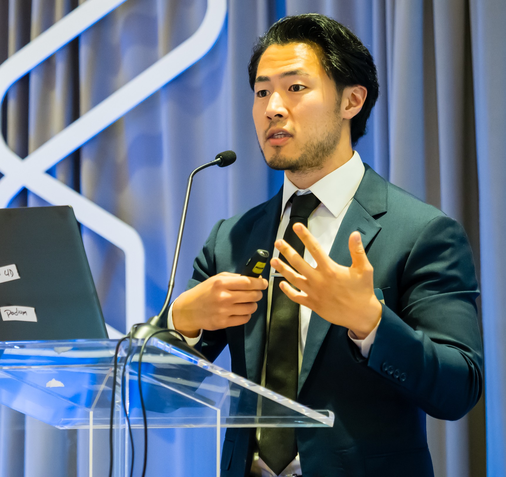 Brian Kim delivering a keynote presentation